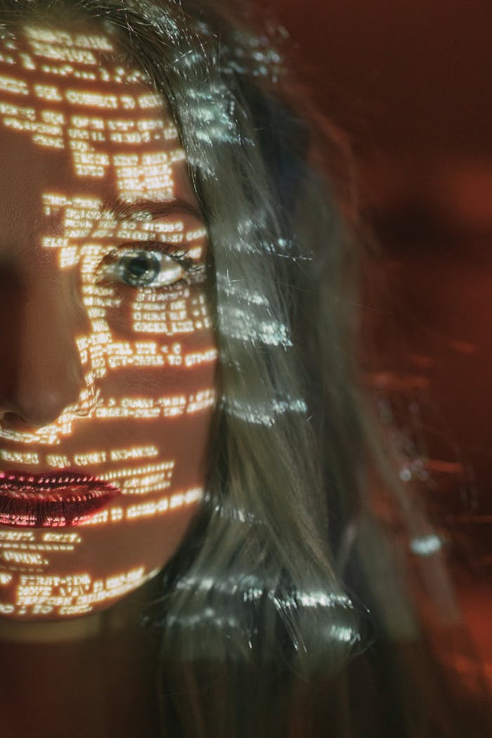 The Art of Drawing Readers In: Your attractive post title goes here Abstract cyberpunk portrait with code projected on a woman's half face, symbolizing technology integration.
