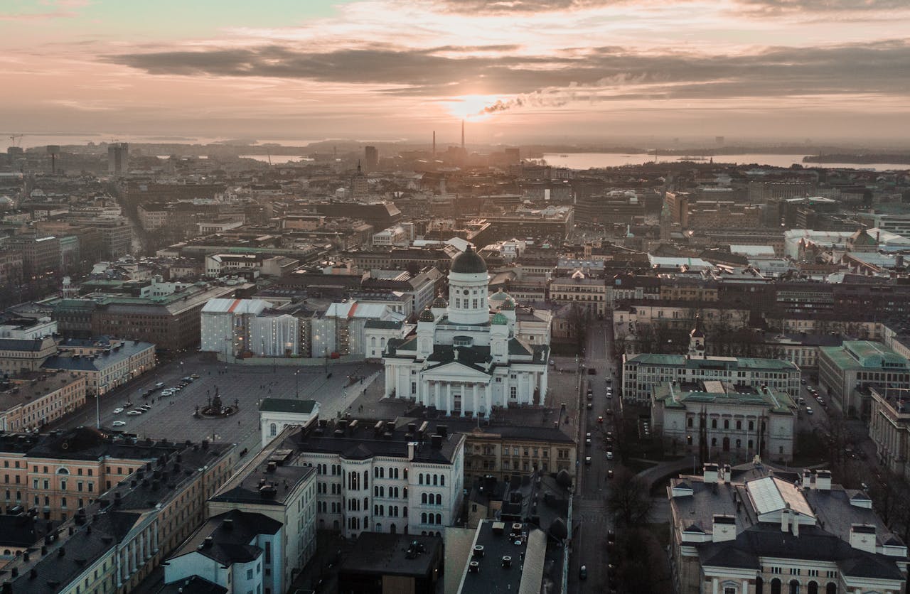 about-us A breathtaking aerial view of Helsinki cityscape with the iconic Helsinki Cathedral at sunset.