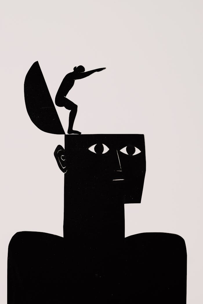 Abstract art depicting a silhouette diver leaping from an open head, symbolizing imagination.